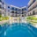 a pool in a courtyard between buildings