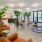 a room with a few chairs and plants