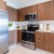 a kitchen with wooden cabinets