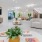 a large room with a large white floor and a large tv
