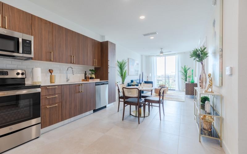 a kitchen with wooden cabinets