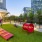 a park with benches and a fence